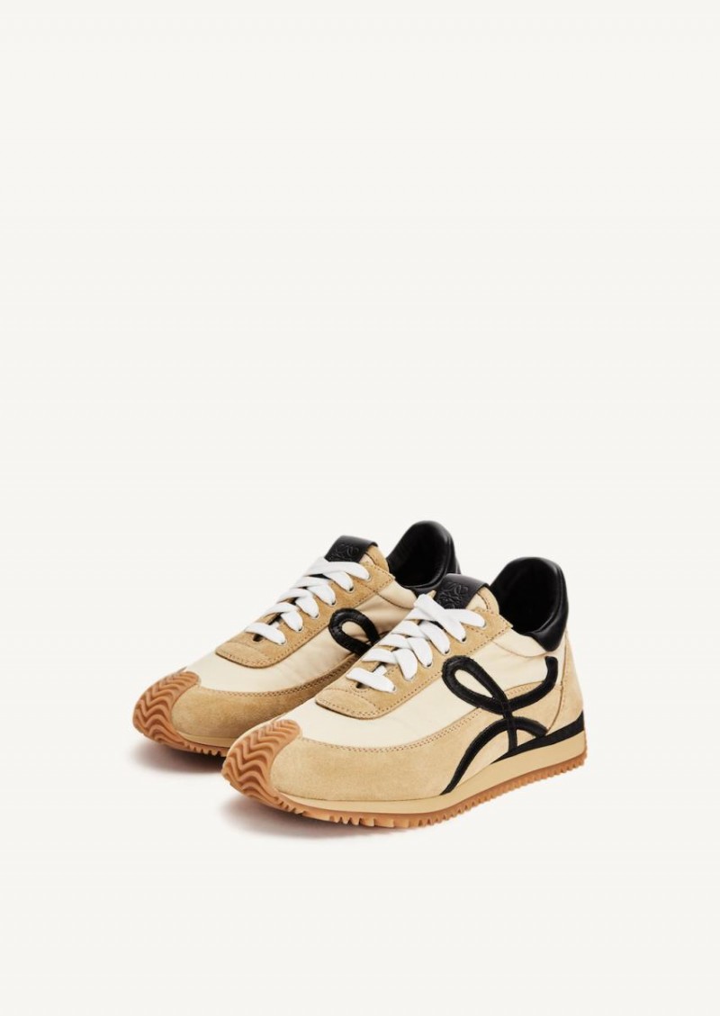 Gold and black Flow runner sneakers