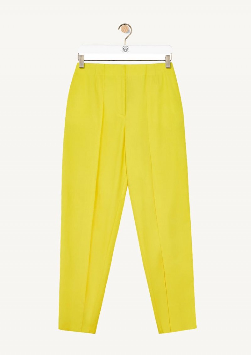 Yellow pleated carrot trousers