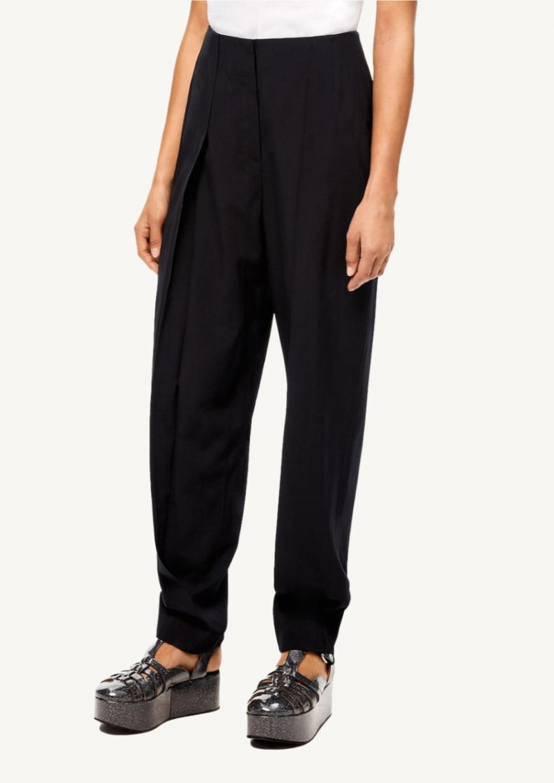 Black pleated carrot trousers