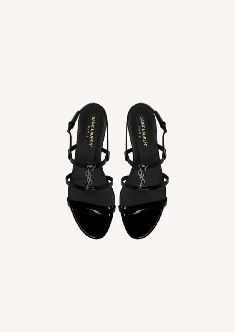 Black Cassandra flat sandals in patent leather