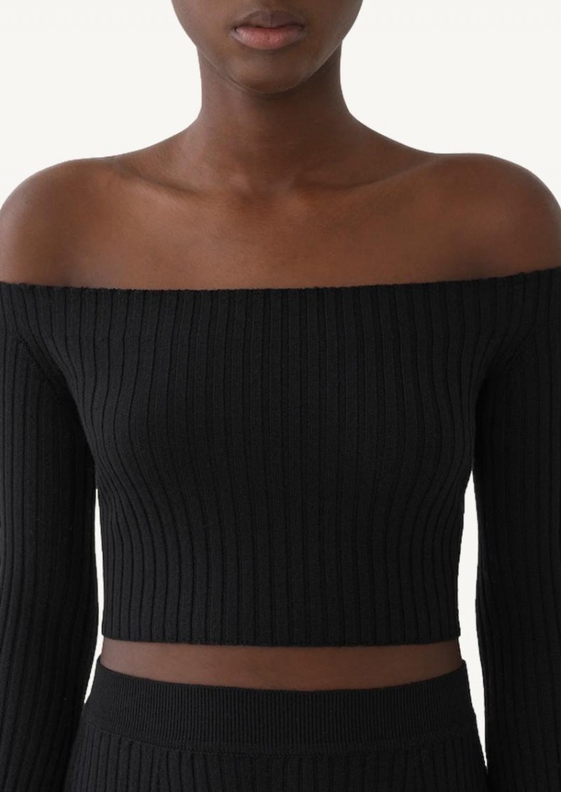 Short black sweater with bare shoulders