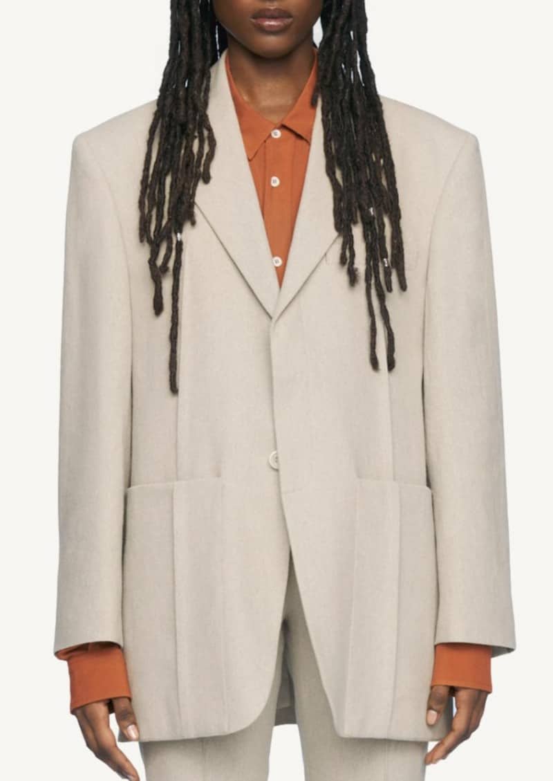 The beige man's jacket
