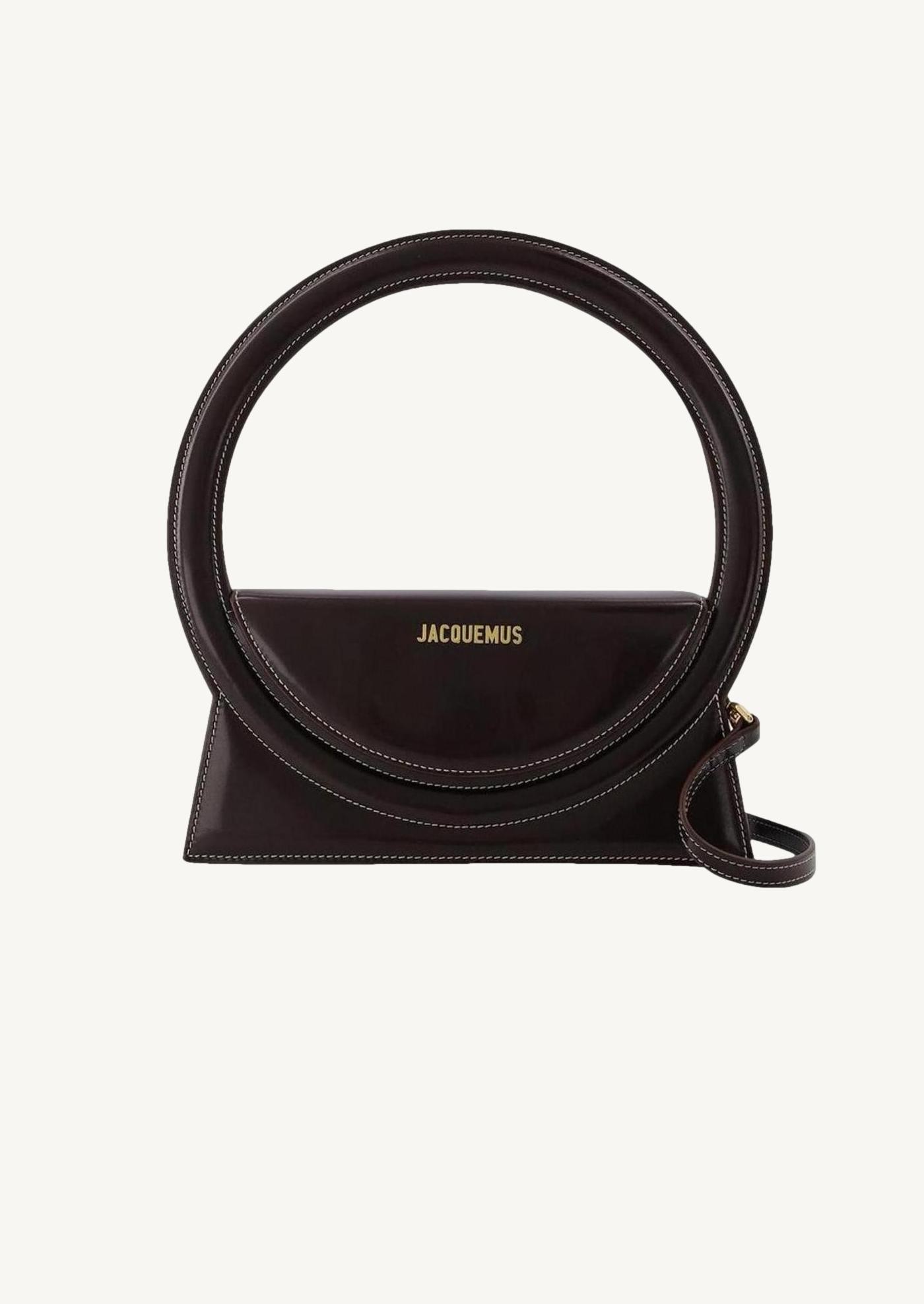 The round dark brown bag Jacquemus Département Féminin