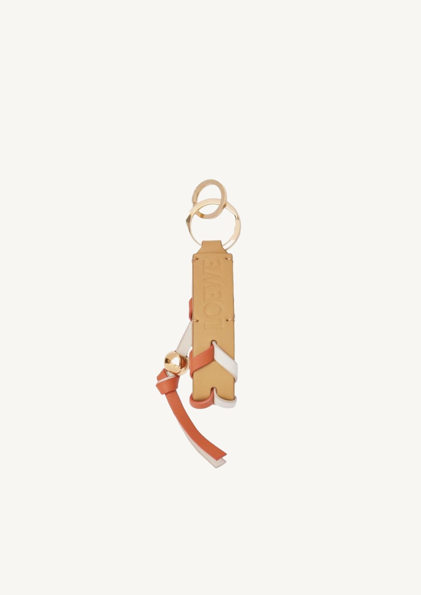 Porte-clés braided en cuir de veau blanc/orange